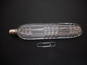 A long glass scent bottle with a silver cap. c1820. English.