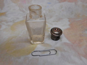 A glass perfume bottle from an 1870s standing etui. Continental.