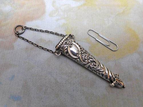 A silver scissor holder from a chatelaine. HM. 1888 D & LS.