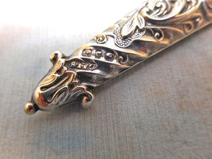 A silver scissor holder from a chatelaine. HM. 1888 D & LS.