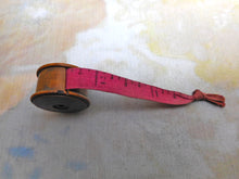 Load image into Gallery viewer, A small wooden tape measure. c1900
