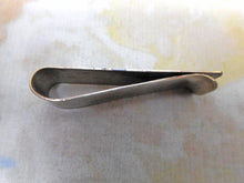 Load image into Gallery viewer, A silver money clip with niello decoration. c1920
