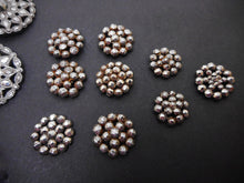 Load image into Gallery viewer, A card of 18 steel buttons. 19th century.
