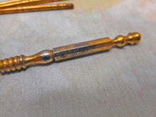 Load image into Gallery viewer, Four gilt steel crochet hooks and the universal handle. c1860.
