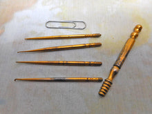 Load image into Gallery viewer, Four gilt steel crochet hooks and the universal handle. c1860.
