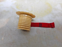 Load image into Gallery viewer, A pearl topped tape measure. c1850. -new tape.
