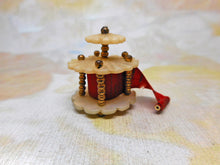 Load image into Gallery viewer, A mother of pearl 'bandstand' tape measure. c1850
