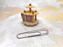 Load image into Gallery viewer, A mother of pearl 'bandstand' tape measure. c1850
