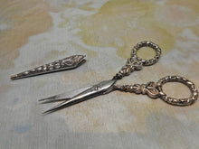 Load image into Gallery viewer, A small pair of silver scissors with blade sheath. English. c1830
