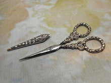 Load image into Gallery viewer, A small pair of silver scissors with blade sheath. English. c1830
