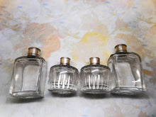 Load image into Gallery viewer, A set of four early French bottles. Palais Royal c1800.
