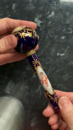 video of the porcelain parasol handle.