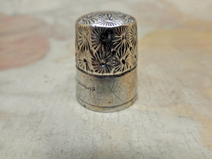A decorative 'Little Dorcas' thimble. c1910