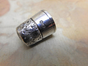 A decorative 'Little Dorcas' thimble. c1910