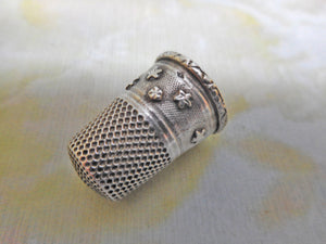 A silver thimble with applied stars. c1870. French.