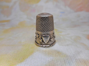 A silver thimble with applied stars. c1870. French.