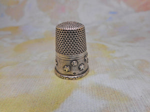 A silver thimble with applied stars. c1870. French.