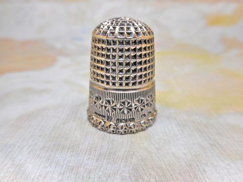 A very pretty silver thimble. Chester 1896 HW Ltd