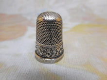 Load image into Gallery viewer, A silver thimble embossed with a band of flowers. c 1835 a/f
