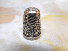 Load image into Gallery viewer, A silver thimble embossed with a band of flowers. c 1835 s/d
