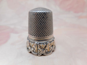 A French silver thimble with applied border. c 1870