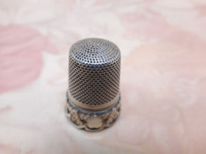 A French silver thimble with applied border. c 1870