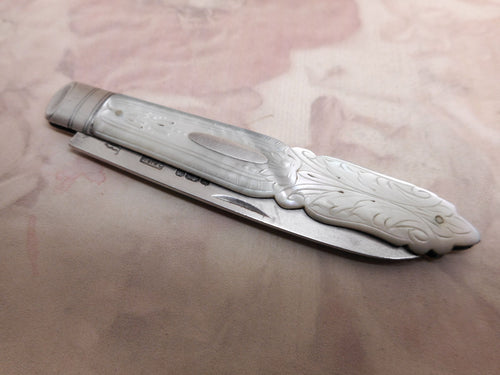 A Victorian folding fruit knife hall marked 1879 on the silver blade.