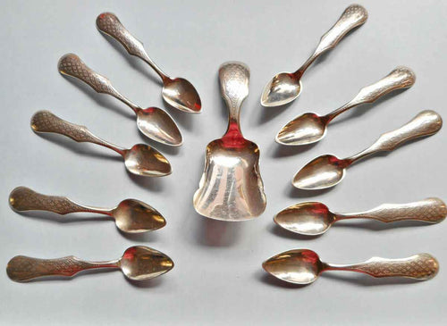 Ten Dutch silver spoons and matching tea caddy spoon. 19thc