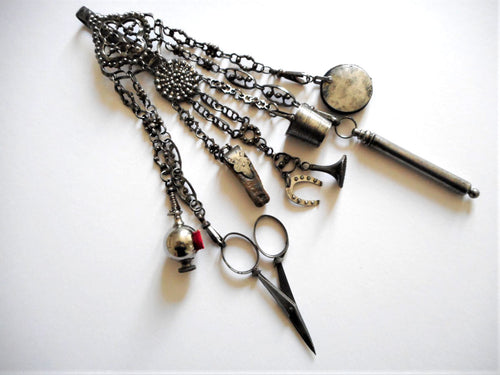 An antique cut steel chatelaine. c 1860