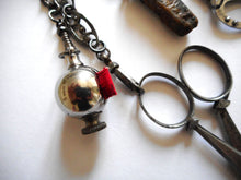 Load image into Gallery viewer, A fine cut steel chatelaine with steel studding. c 1860
