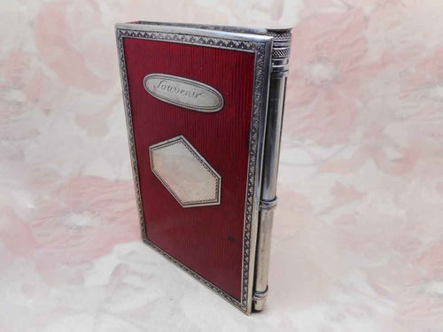 A French red leather notebook with silver trim and silver pencil. c 1840