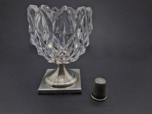 A Georgian silver bonbon glass on a silver base.