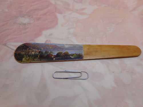 A wooden page marker with a painting of Montreux