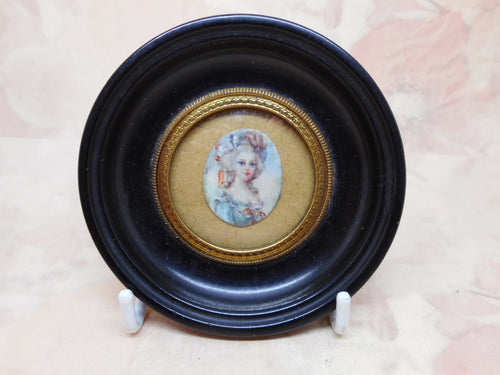 A framed miniature portrait of a lady. c 1820