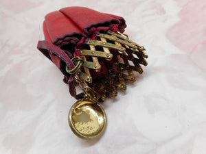 Red leather expanding purse. c 1890