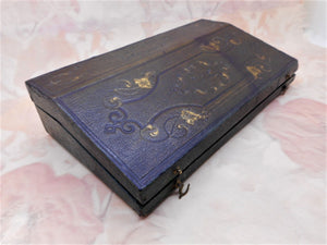 SOLD...........A tooled leather box in the form of a lap desk fitted with writing tools. French c 1840