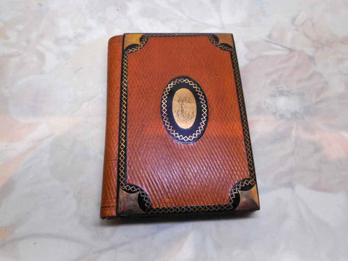 A French tan leather notebook with a lacquer trim inlaid with gold pique. c 1860