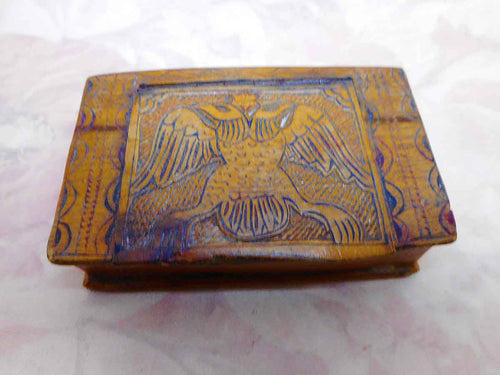 A wooden snuff box carved with a double headed eagle. 19th century.