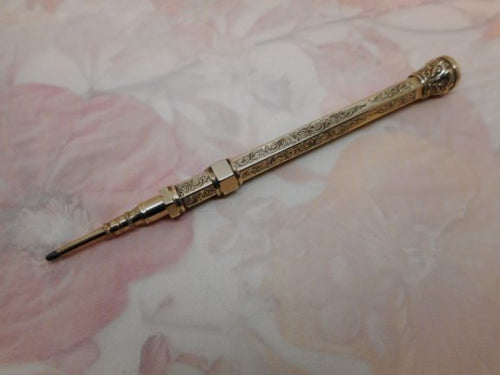 A 9 carat gold propelling pencil in working order. c 1870