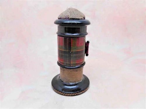 A Tartan Ware combination sewing tool-a tape measure, emery and thread waxer. McPherson.  c1860