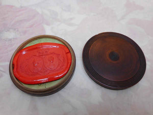 A Royal commemorative wax letter seal in its wooden case.