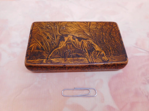 A pen and ink snuff box decorated with a hound dog. c 1830