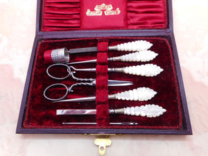 A good quality red leather cased sewing set. c 1900- 1920