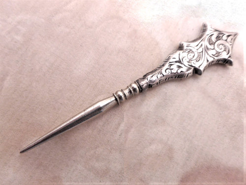 An engraved silver stiletto / awl. Antique sewing.