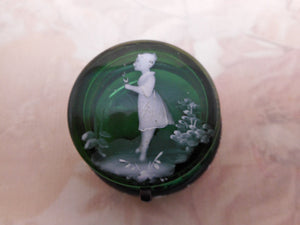 SOLD…….A green glass trinket box with 'Mary Gregory' decoration. c1900