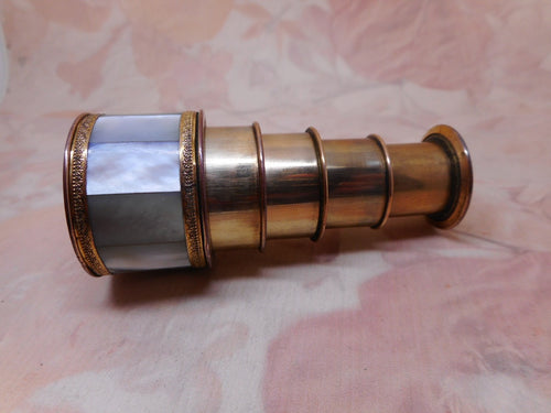 A mother of pearl monocular.  4 -drawer c1840