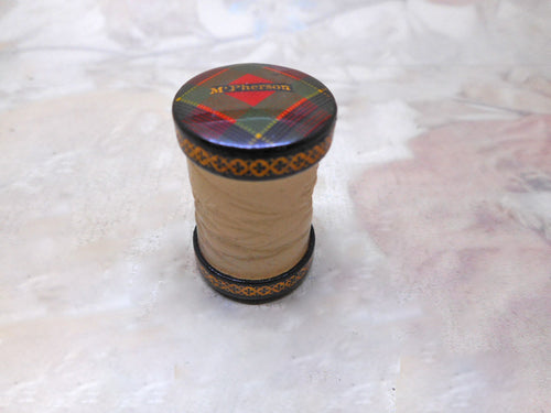 A Tartan Ware thread waxer. McPherson.