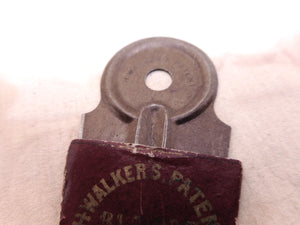 An unusual metal buttonhole cutter. 'Walker's Patent' wrapper. 19thc