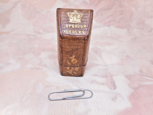 A tooled leather 'knife slope' needle packet box. circa 1850