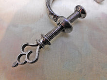 Load image into Gallery viewer, A fine cut steel netting clamp. c 1800
